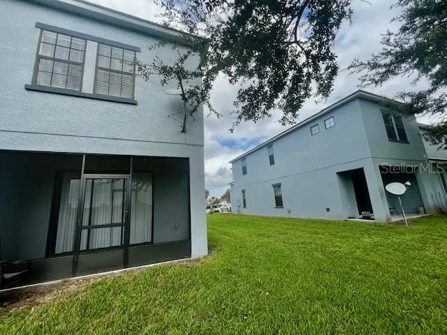a view of a hallway with a livingroom and entryway
