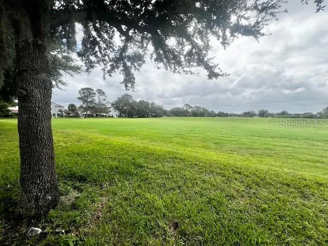 a bathroom with a double vanity sink a mirror and a bathtub