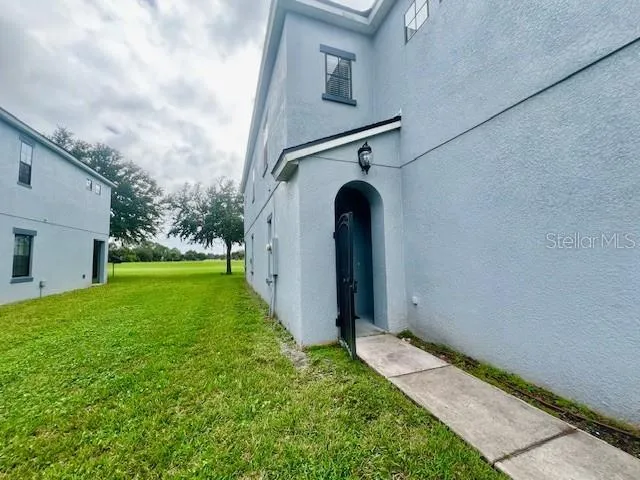 a view of outdoor space with sign board and garden