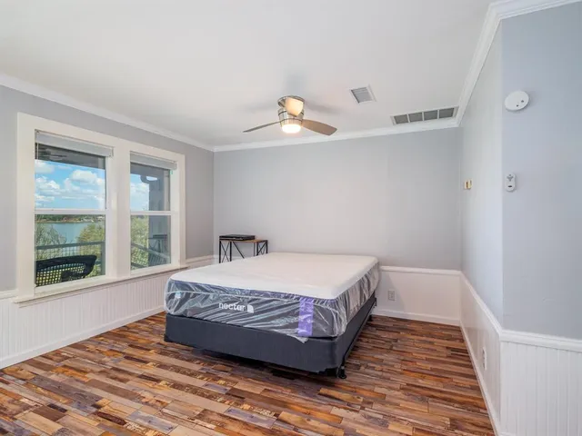 a bedroom with a bed and window