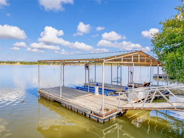 a view of a patio with swimming pool table and chairs