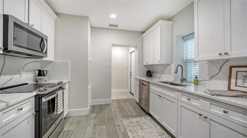 1901 Morrill Street Sarasota, FL 34236 - Photo 14 of 50 a kitchen with stainless steel appliances a stove microwave and sink