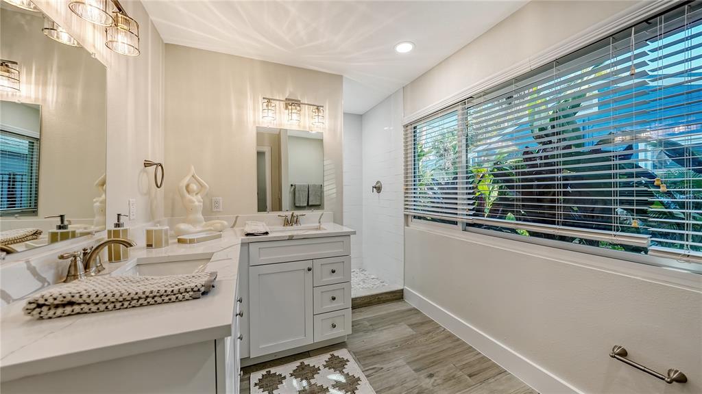 1901 Morrill Street Sarasota, FL 34236 - Photo 18 of 50 a bathroom with a granite countertop sink and a mirror