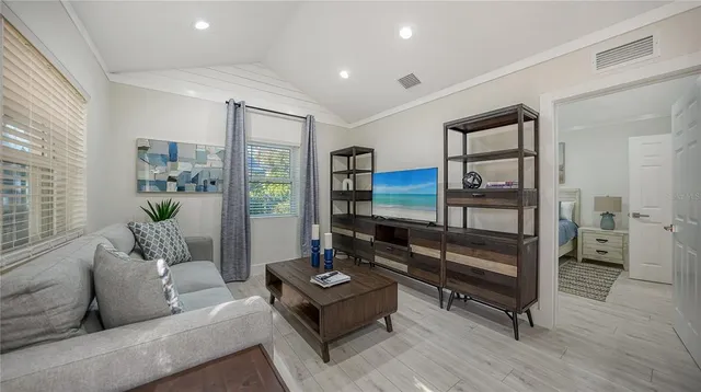 a living room with furniture and a gate