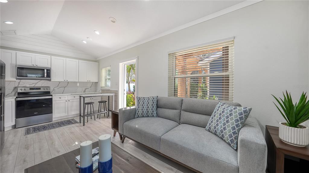 1901 Morrill Street Sarasota, FL 34236 - Photo 25 of 50 a living room with furniture and a open kitchen