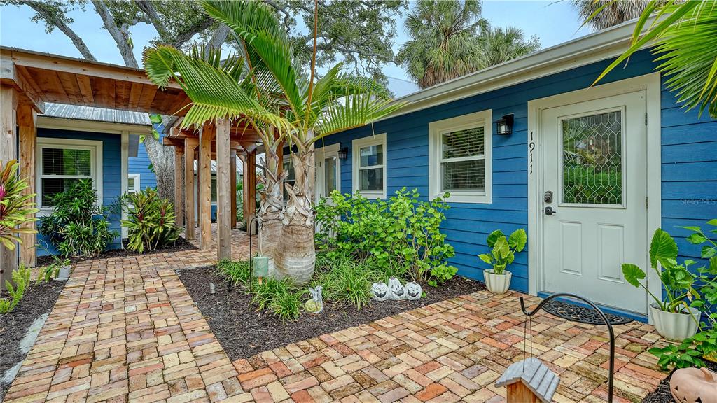 1901 Morrill Street Sarasota, FL 34236 - Photo 29 of 50 a view of a house with potted plants and a bench