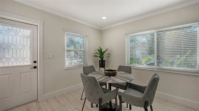 a view of a dining room with furniture window and outside view