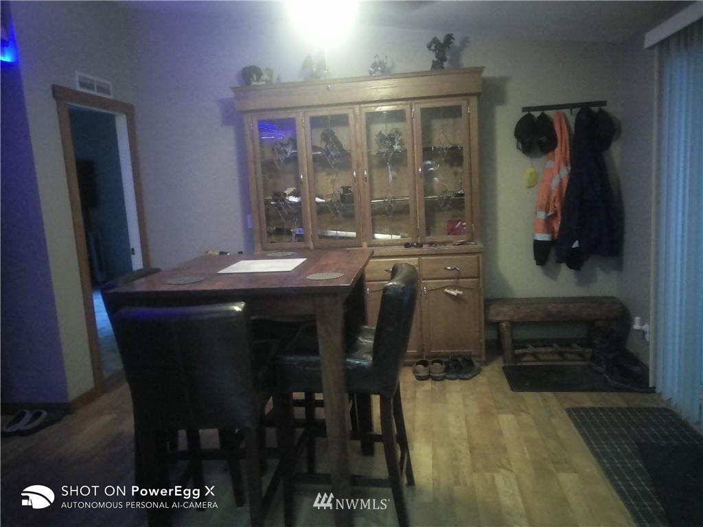 6618 Kickerville Road Ferndale, WA 98248 - Photo 16 of 30 a dining room with furniture and wooden floor
