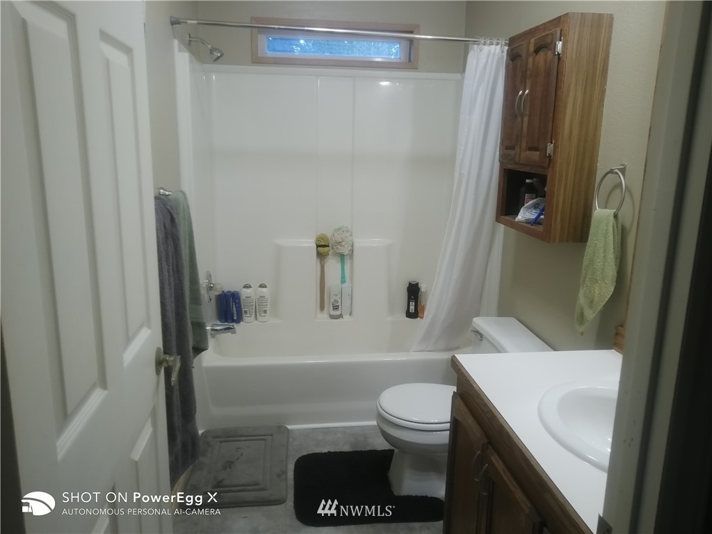 6618 Kickerville Road Ferndale, WA 98248 - Photo 18 of 30 a bathroom with a toilet and a shower