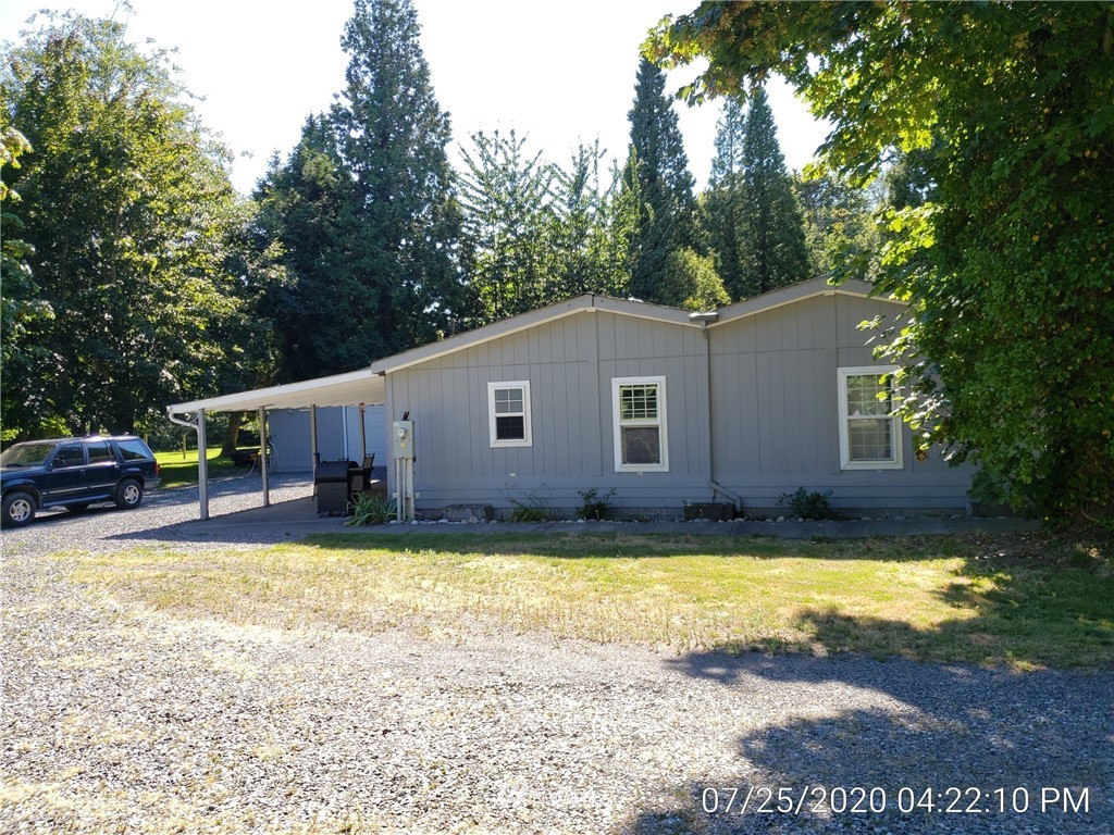 6618 Kickerville Road Ferndale, WA 98248 - Photo 22 of 30 a view of a house with swimming pool and a yard