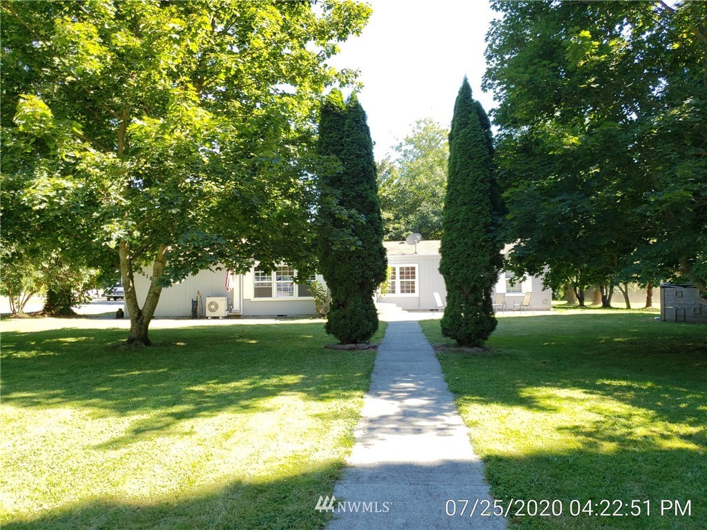 6618 Kickerville Road Ferndale, WA 98248 - Photo 23 of 30 a view of a yard with plants and a large tree