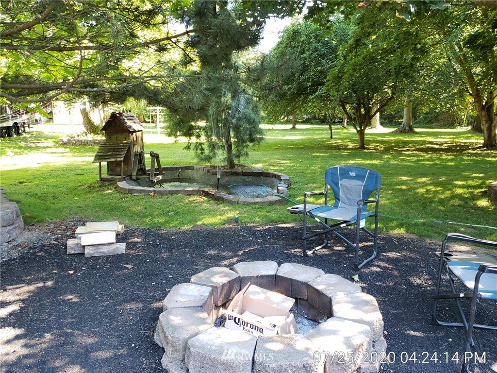 6618 Kickerville Road Ferndale, WA 98248 - Photo 27 of 30 a backyard of a house with a yard and outdoor seating