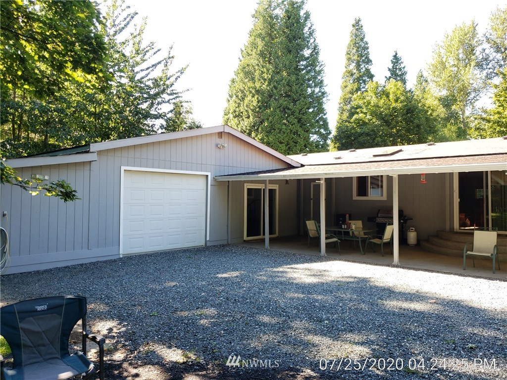 6618 Kickerville Road Ferndale, WA 98248 - Photo 28 of 30 a view of a house with a backyard and sitting area