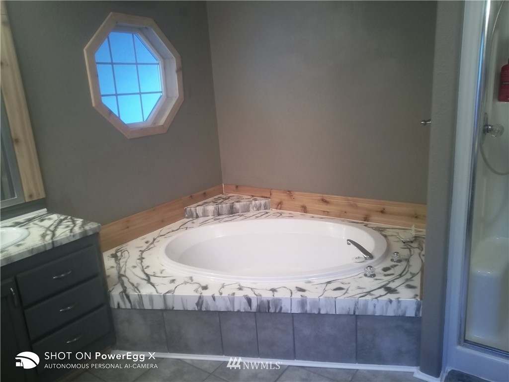 6618 Kickerville Road Ferndale, WA 98248 - Photo 10 of 30 a view of wooden floor in a bathroom
