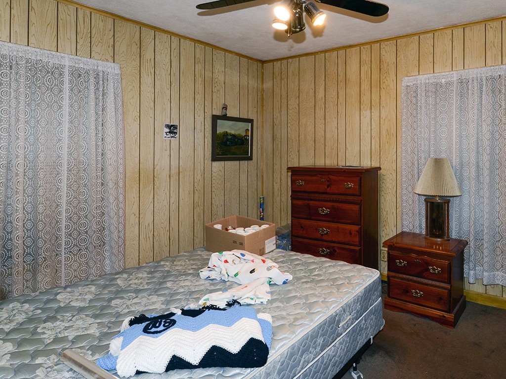 125 Malden Street Springfield, MA 01108 - Photo 9 of 24 a bedroom with a bed and a dresser