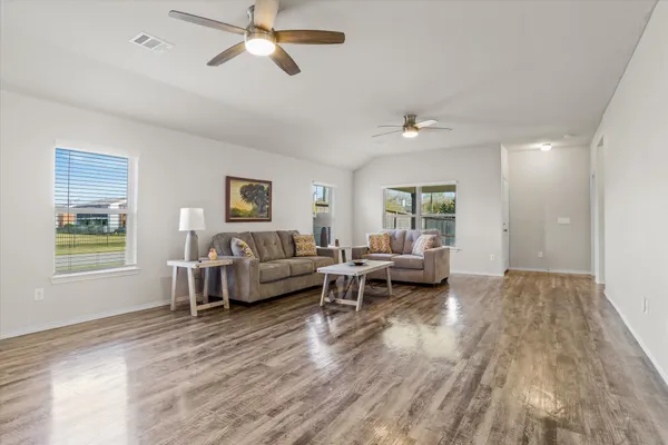 a living room with furniture and a window