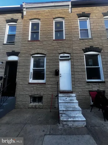 a brick house with wooden door
