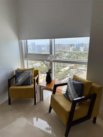 a bedroom with furniture and window