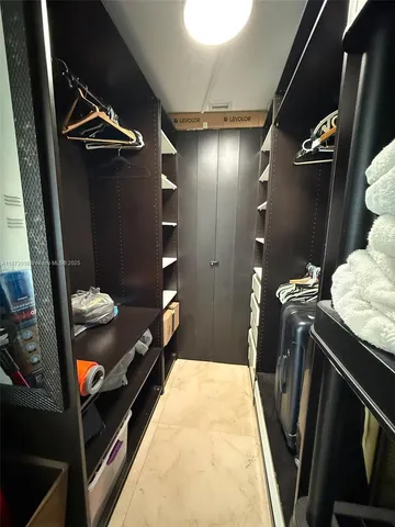 a spacious bathroom with a sink and a mirror