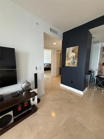 a room with furniture and a flat screen tv