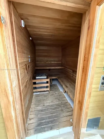 a swimming pool with outdoor seating and yard