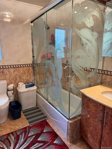 a bathroom with a bathtub and toilet