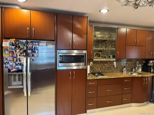 a kitchen with a refrigerator and cabinets