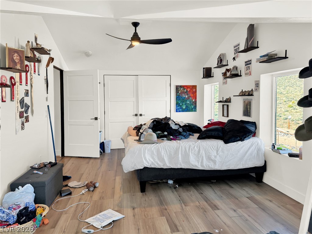 9393 North 93rd Highway Caliente, NV 89008 - Photo 10 of 41 Natural light illuminates this bedroom, offering vaulted ceilings and ample space.