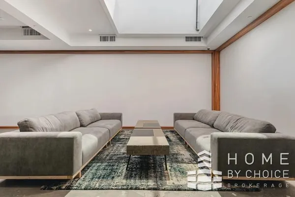 a living room with furniture and a rug