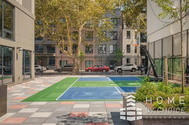 a view of yard with tall buildings