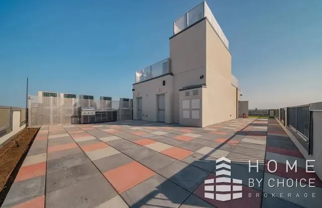 a view of a swimming pool with an outdoor seating and a yard