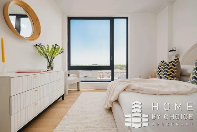 a bedroom with bed and window