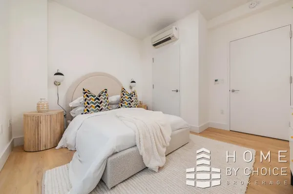 a bedroom with a bed and a table