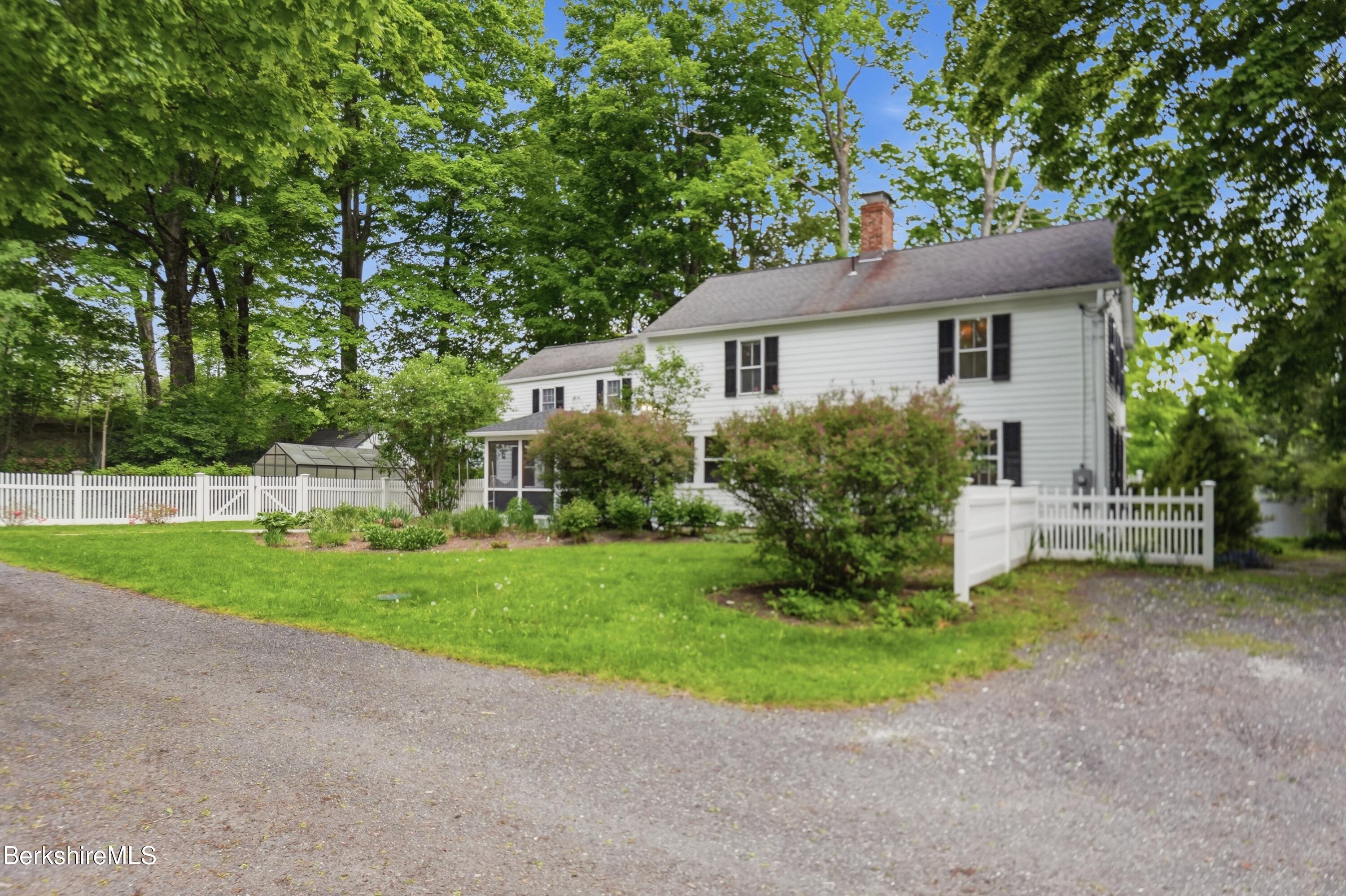 4 Stockbridge Road West Stockbridge, MA 01266 - Photo 8 of 94 a front view of a house with a garden and yard