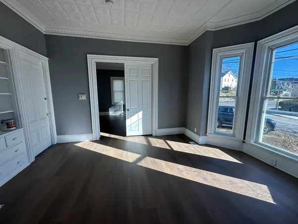 a view of an empty room with glass door