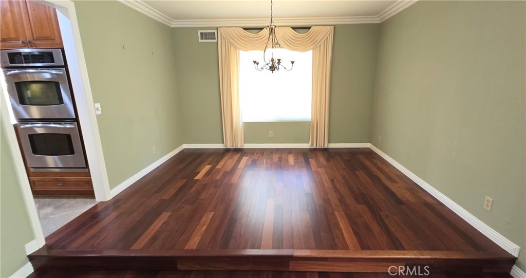 1400 Post Fullerton, CA 92833 - Photo 18 of 70 a view of a hallway with wooden floor and staircase