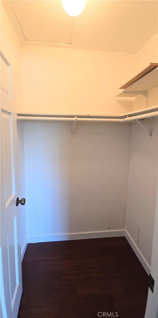 1400 Post Fullerton, CA 92833 - Photo 46 of 70 an empty room with wooden floor and cabinet