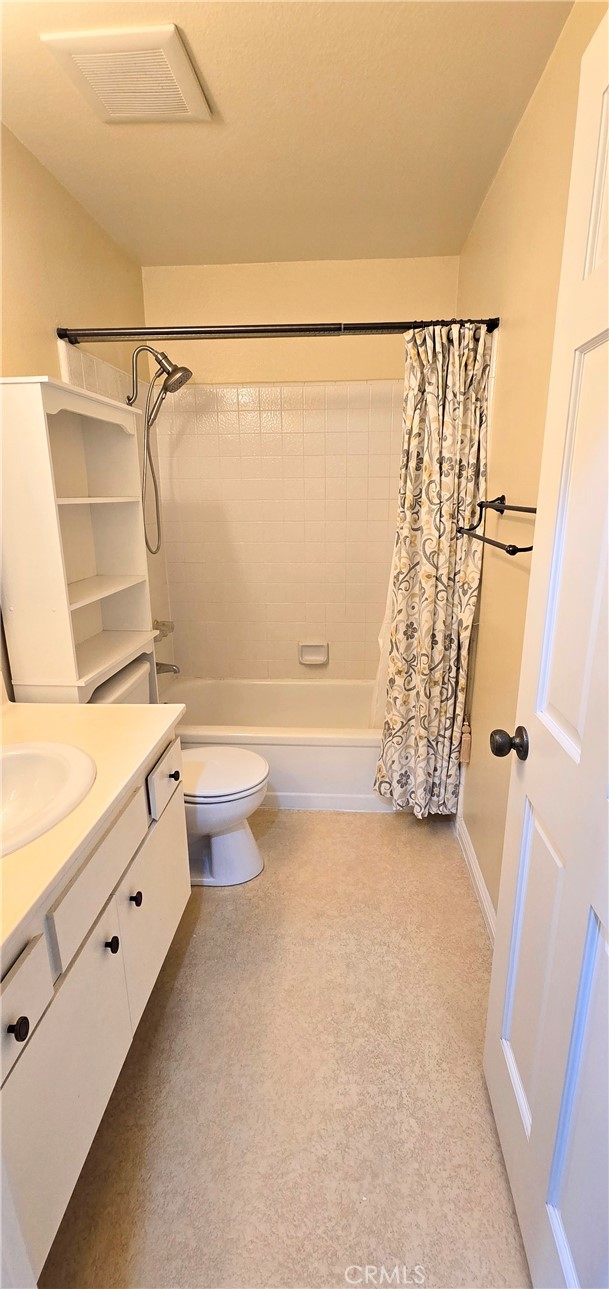 1400 Post Fullerton, CA 92833 - Photo 52 of 70 a bathroom with a granite countertop shower toilet and a shower
