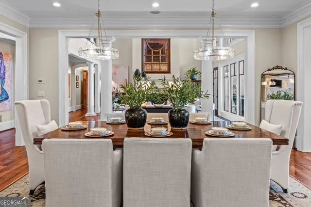 a view of a dining room with furniture and a window