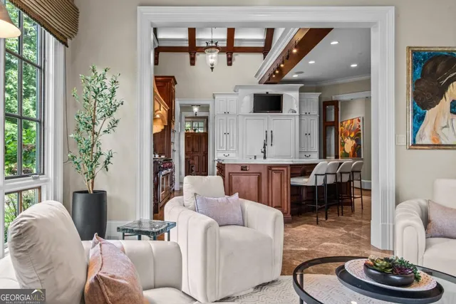 a kitchen with stainless steel appliances granite countertop a sink a stove and a refrigerator