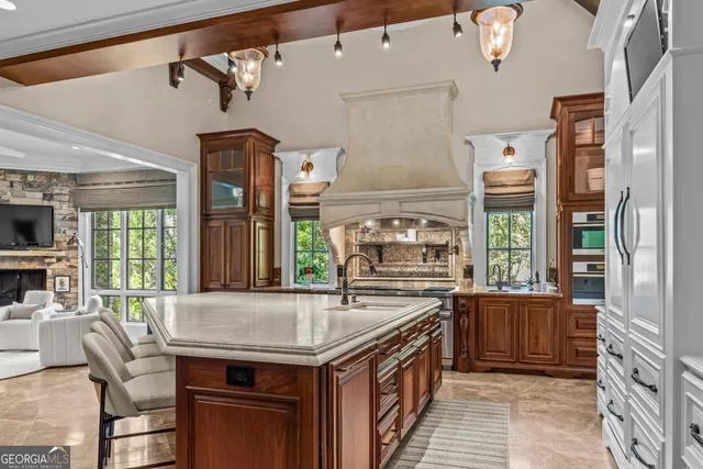 a kitchen with a sink and a large window