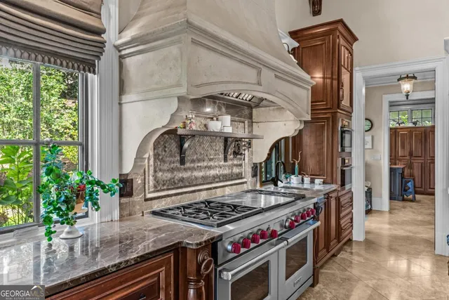 a bathroom with a tub a sink and a mirror