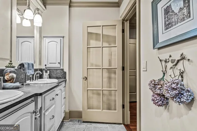 a view of a bathroom with sink and mirror