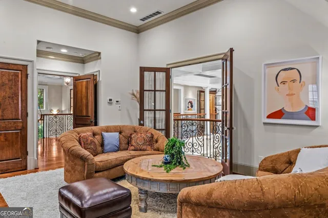 a bedroom with two beds and a chandelier