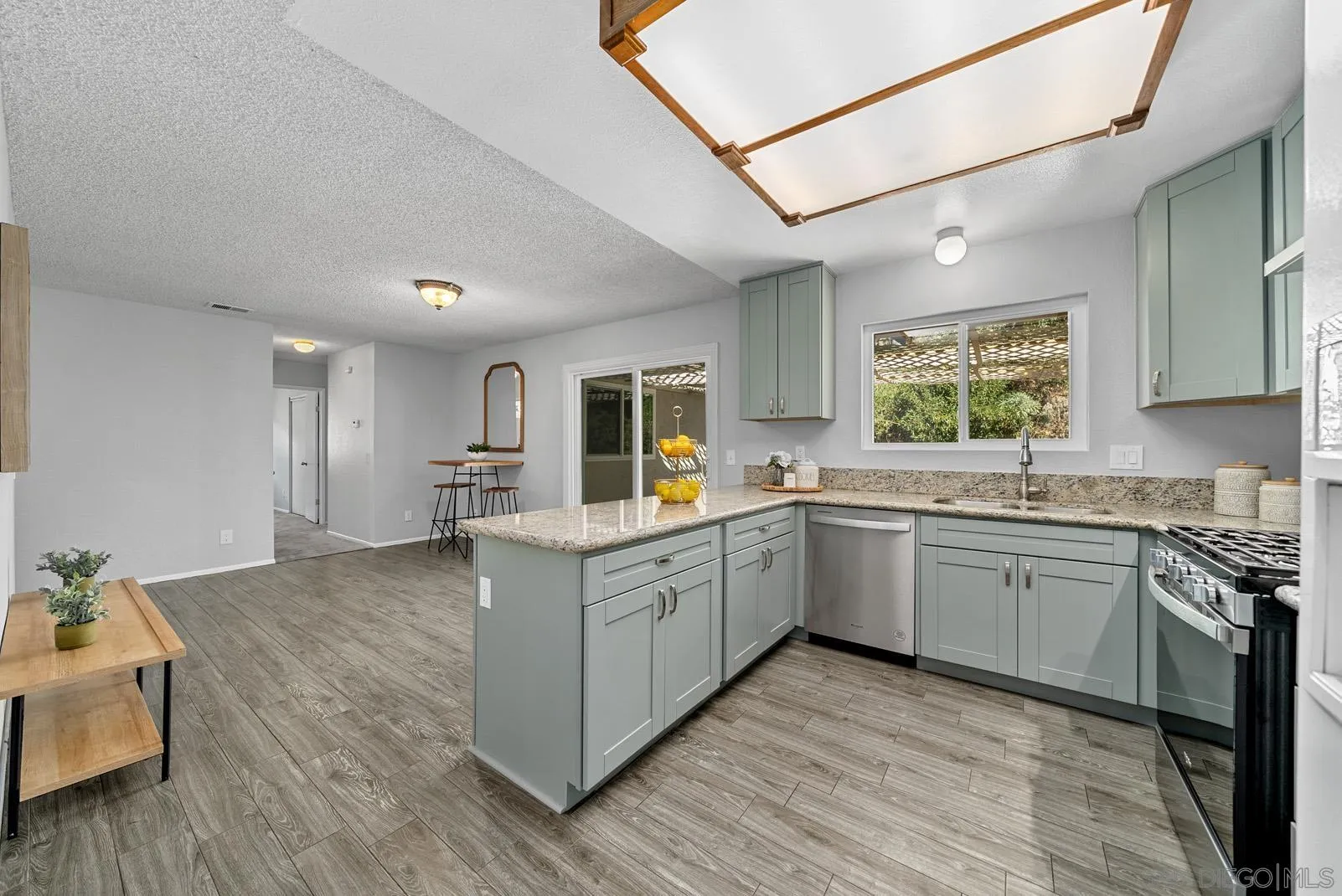 950 East Fallbrook Street Fallbrook, CA 92028 - Photo 11 of 37 a kitchen with granite countertop cabinets stainless steel appliances a sink and a window