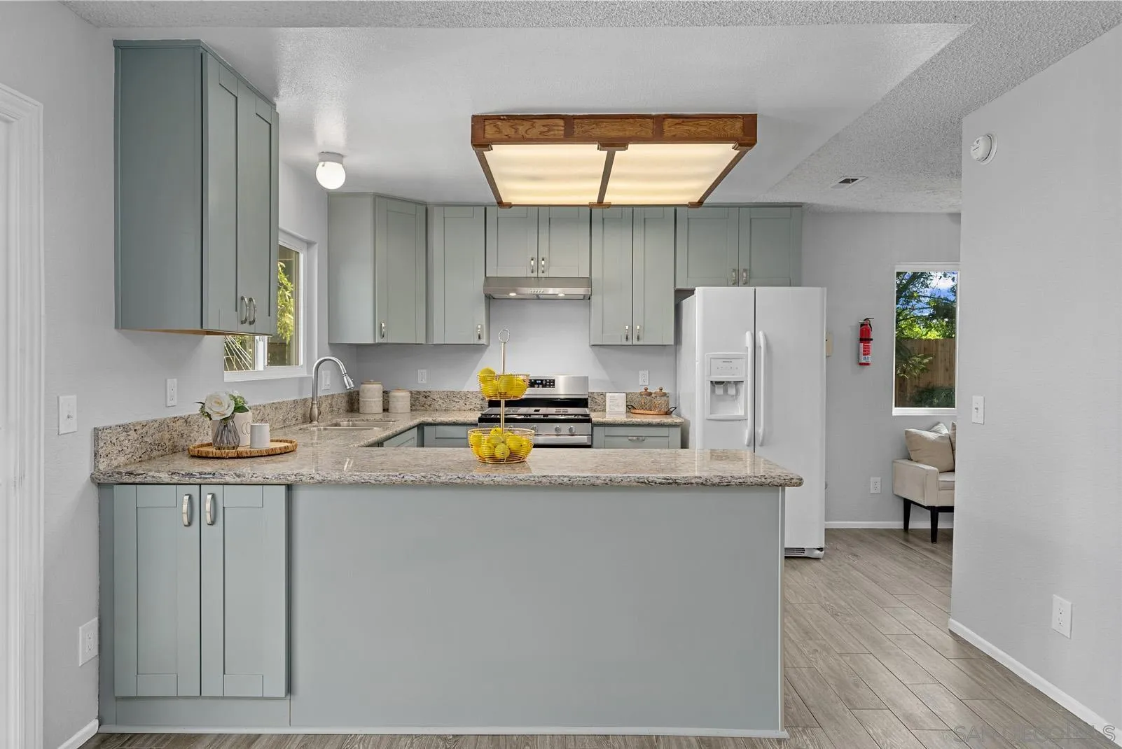 950 East Fallbrook Street Fallbrook, CA 92028 - Photo 12 of 37 a kitchen with a sink a refrigerator and a stove
