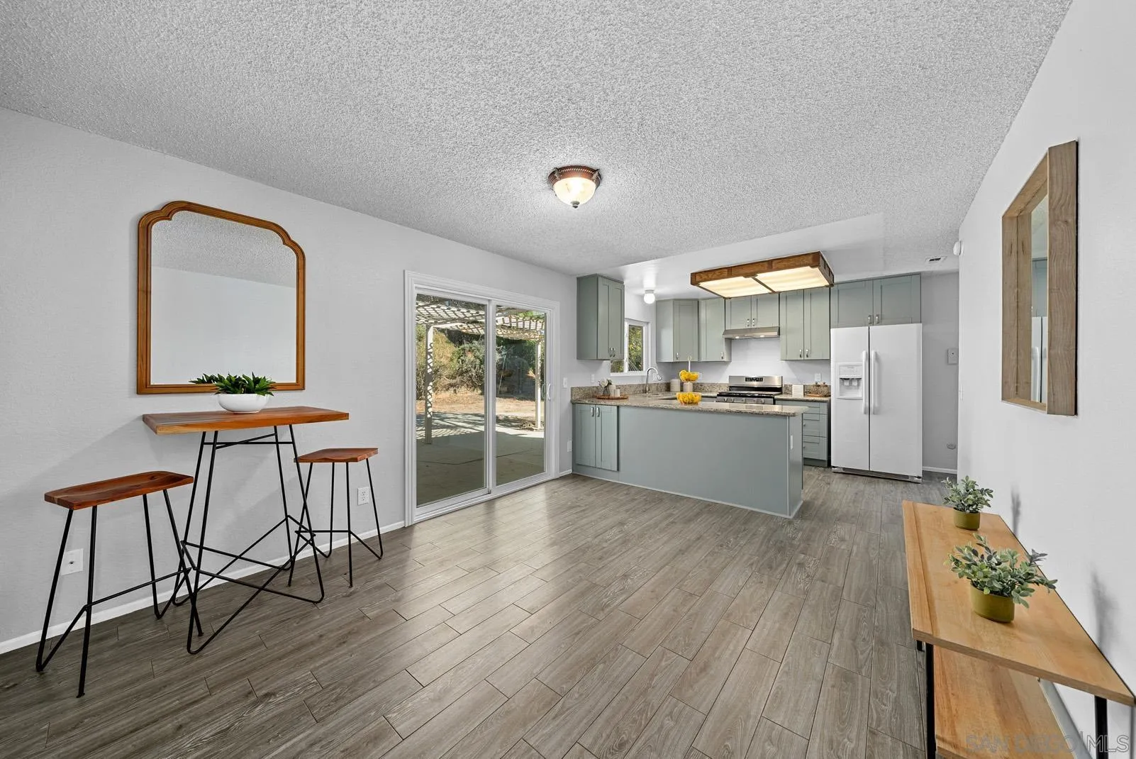 950 East Fallbrook Street Fallbrook, CA 92028 - Photo 13 of 37 a living room with stainless steel appliances kitchen island wooden floor and view living room