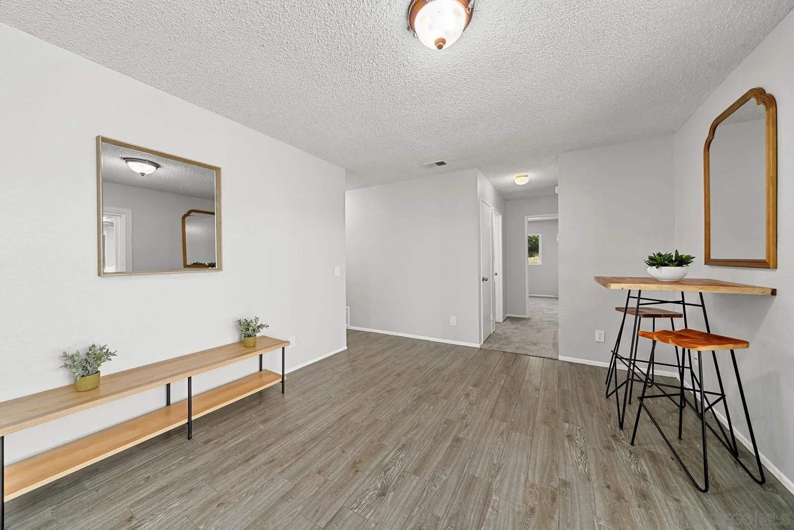 950 East Fallbrook Street Fallbrook, CA 92028 - Photo 15 of 37 a view of a workspace with furniture and wooden floor
