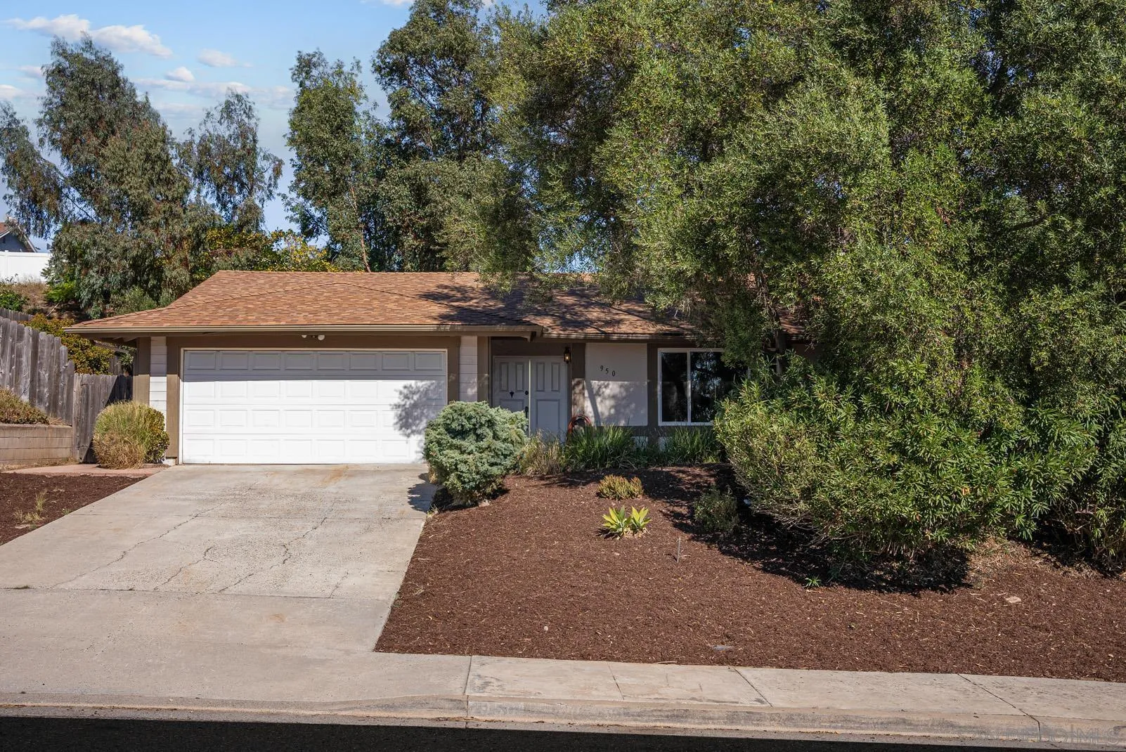950 East Fallbrook Street Fallbrook, CA 92028 - Photo 3 of 37 a front view of a house with garden