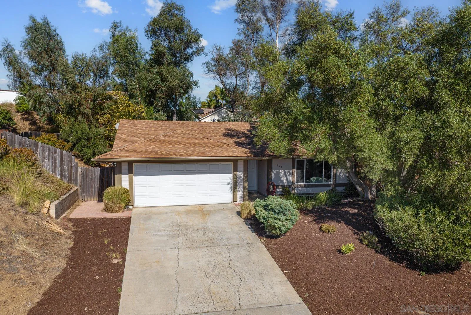 950 East Fallbrook Street Fallbrook, CA 92028 - Photo 31 of 37 a front view of a house with a yard and garage